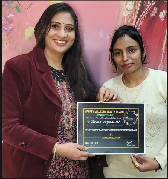 Bimla presenting a Manasvi makeup master class certificate to a successful student