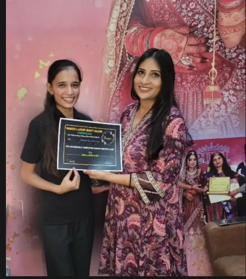 Manasvi beauty training graduate receiving her makeup master class certificate from Bimla Makeover